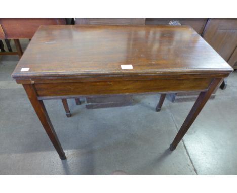 A mahogany rectangular fold over card table 