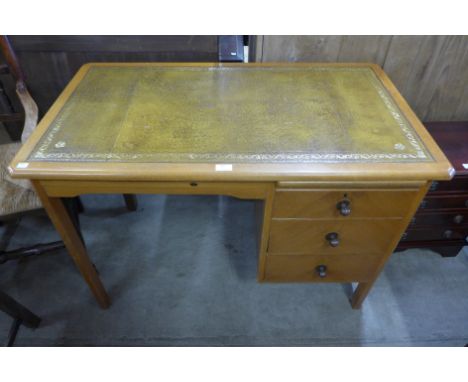 A light oak and green leather topped desk 