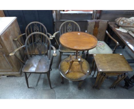 A walnut nest of tables and coffee table, a mahogany wine table, a bergere fire side chair and three Ercol fleur de lys chair