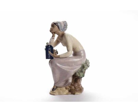 LARGE LLADRO BISQUE FIGUREmodelled as a girl resting on a tree branch over a naturalistic base, blue printed mark and impress