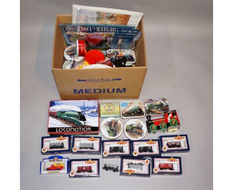 A large quantity of reproduction railway tins, Bachmann 00 scale railway trucks, tin plate signs, prints, L.N.E.R. platform t