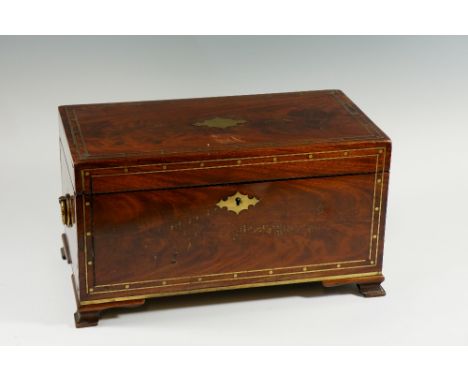 A Regency mahogany veneered tea caddy inlaid overall with brass stringing and sphere decoration, the hinged lid with vacant c
