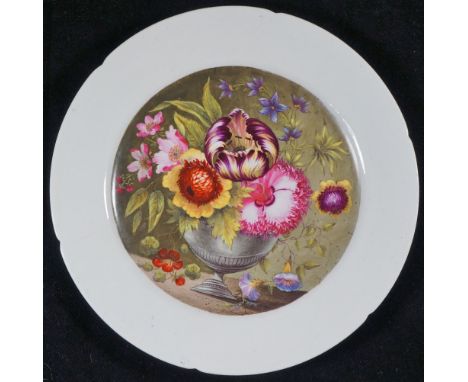 A Coalport plate, unfinished, the centre finely painted with floral blooms in a metal urn, 21.5 cm diameter, Circa 1810