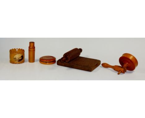 A Mauchline ware napkin ring applied photographic oval of Ilfracombe, 5 cm diameter; a turned boxwood sewing implement, a box