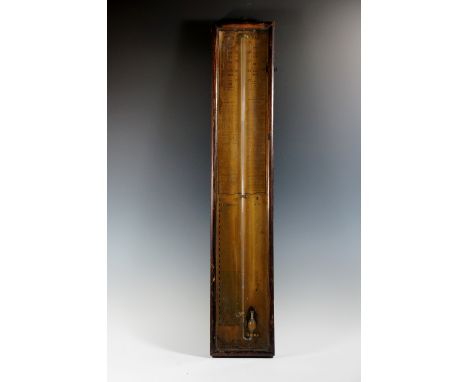 A Victorian Admiral Fitzroy's barometer with papered back, rectangular glazed case, 90 cm high, mid 19th Century (lacking the