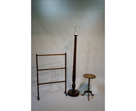 A George III mahogany bedpost, now mounted as an electric light; a mahogany towel rail, a reproduction mahogany tripod occasi