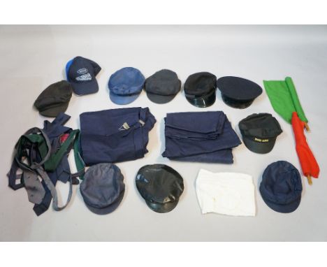 A British Railways cap, another London 1964, an engine driver's cap, four others, a quantity of overalls, Aslef and other tie