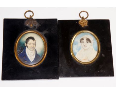 An early 19th Century portrait miniature of a gentleman wearing blue jacket, watercolour on ivory, 7 cm x 5.5 cm; an early 19