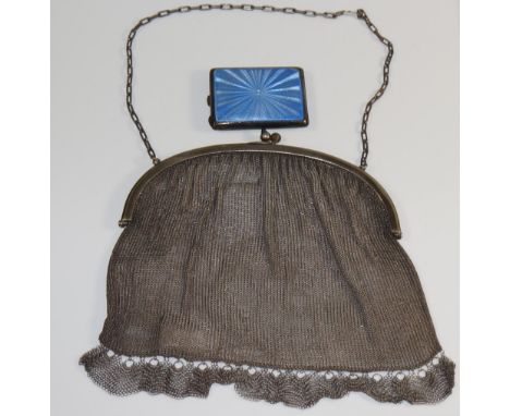 A silver and blue engine turned enamel matchbook cover, 6 cm wide; a white metal mesh evening purse with blue glass cabochon 