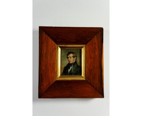 A 19th Century head and shoulder portrait miniature of a gentleman, rosewood frame with gilt slip, 14.5 cm x 13.5 cm overall,
