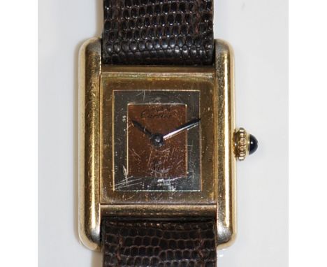 A Cartier silver gilt ladies wrist watch the three colour gold plated face inscribed Must De Cartier, the back inscribed Cart