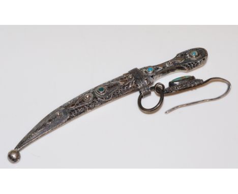 A Russian silver miniature dagger the handle and scabbard filigree decorated and applied turquoise cabochons, with conforming