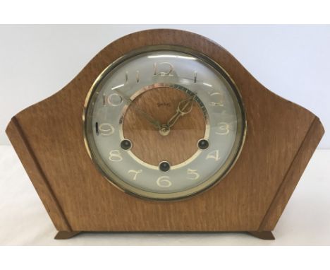 A vintage light wood cased Smiths mantel clock with pendulum but no key.  