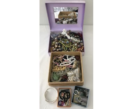 2 boxes of vintage costume jewellery. To include necklaces, bangles, earrings, beads and key rings. 