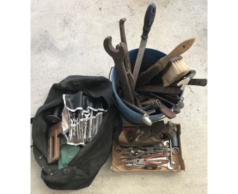 A collection of vintage hand tools to include spanners, wrenches and a Morris, London carpenters smoothing plane. 