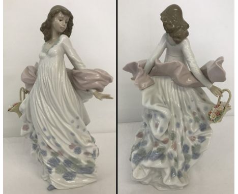 "Spring Splendour" Lladro figurine of windswept woman with a basket of flowers, #5898. In original box. Approx. 30cm tall.