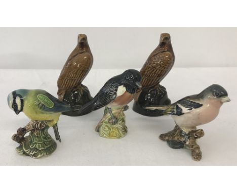 A collection of ceramic Beswick bird figurines. Comprising; 2 Beneagles scotch whisky decanters, Chaffinch #991 (a/f), Blue T