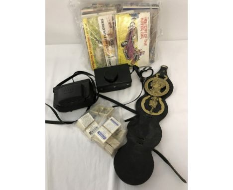 A quantity of assorted items comprising horse brasses, vintage Kodak cameras and A collection of Brooke Bond tea cards and bo