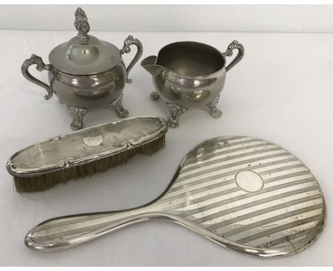 A small quantity of silver and silver plated items. To include silver back hand mirror and brush with engine turned decoratio