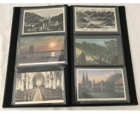 A slim brown album of vintage postcards. To include animals, churches and places of interest. 