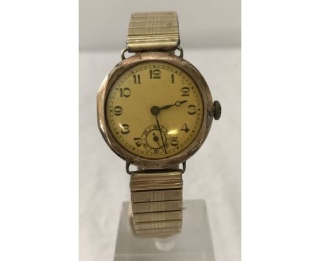 A vintage 9ct gold cased gents wristwatch with Fixoflex patterned rolled gold strap.  