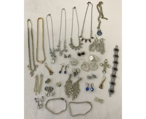 A box of vintage diamante costume jewellery. To include necklaces, earrings and bracelets. 