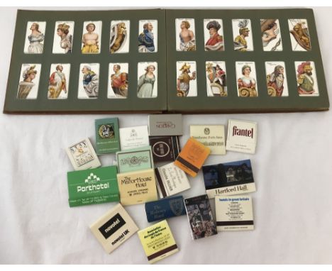 A vintage Players cigarette card album together with a small collection of match books and boxes. Album contains "Colonial & 