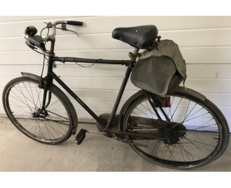 A vintage men's 1950's Raleigh all steel framed bicycle. Fitted with front and rear lights, Chossy bicycle bag fitted to rear