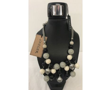 A Jaeger statement necklace of black, white and grey colouration with original tag. Together with a chunky black Jaeger bangl