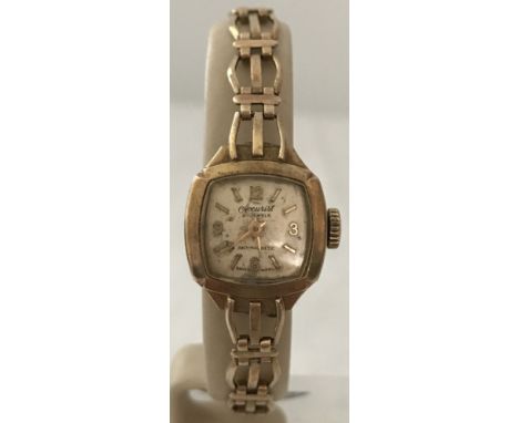 A vintage 9ct gold Accurist ladies cocktail watch in working order. 9ct gold case and strap. Wind-up 