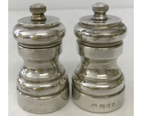 A hallmarked silver over wooden body salt and pepper grinder cruet set. Fully Hallmarked London 1983 with DSS makers mark. Ap