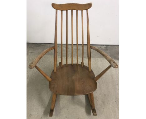 A Ercol children's blonde rocking chair.  