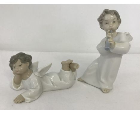 2 Lladro ceramic angel figurines. #4540 Angel with flute and #4541 Angel laying down. In original boxes. Tallest approx. 16.5