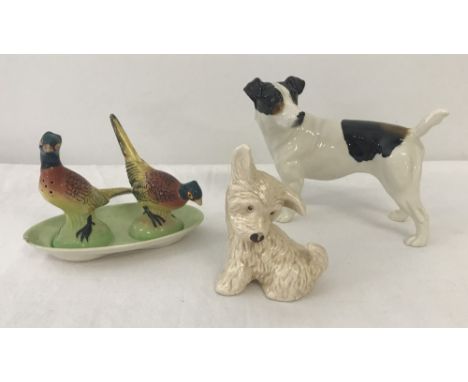 A small collection of ceramic animal figures. Comprising; small Sylvac dog #73, large Beswick style dog and a Chekaleke ceram