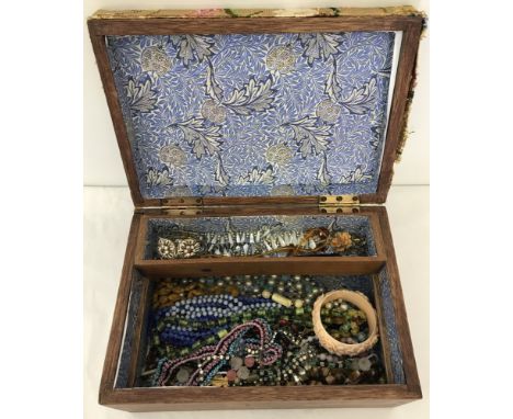 A wooden box containing vintage glass and bead jewellery. To include mother of pearl necklace. 