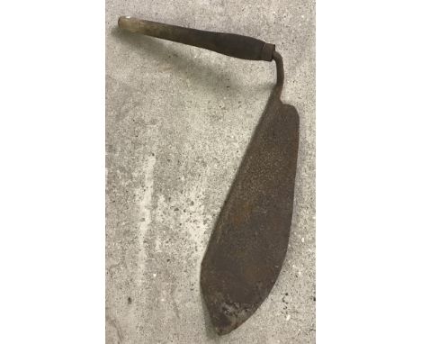 A vintage wooden handled hay knife.  Approx. 71cm long x 58cm wide.