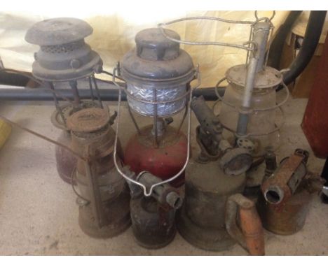 A quantity of vintage lamps, comprising; 2 Hurricane lamps, 2 pressure lamps and 3 brass blow lamps.  
