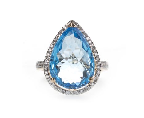 BLUE TOPAZ AND DIAMOND RING, the pear shaped blue topaz of approximately 11.49 carats, within a halo of round brilliant cut d
