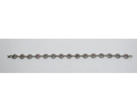 Art Deco style 18ct white gold ruby and diamond bracelet composed of alternating circular and bar links, 15.2g 