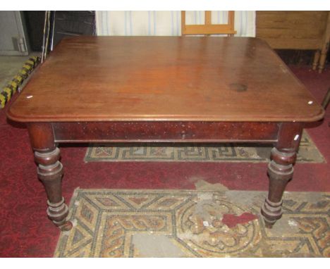 A Victorian mahogany pull out extending dining table of rectangular form with moulded outline, rounded corners and single add