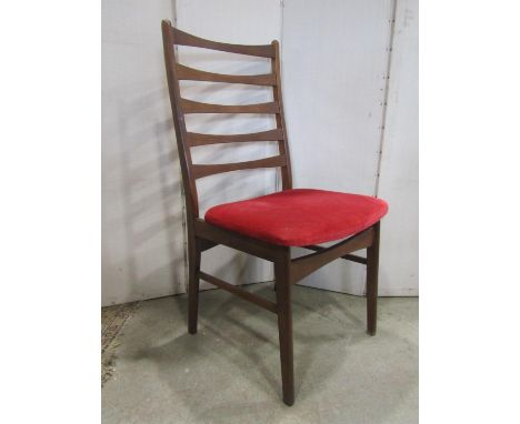 A set of six mid 20th century Danish teak slender ladder back dining chairs with upholstered pad seats, raised on slightly ta