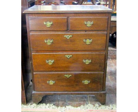 A small Georgian oak two sectional bedroom chest of two short over three long graduated drawers raised on bracket supports, 8