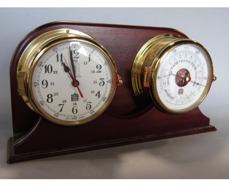Modern Sewills twin clock and barometer thermometer with mahogany frame, with bulk head type case work, 46 cm long 
