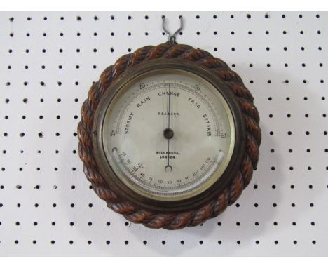 R &amp; J Beck of 31 Cornhill, London, rope twist oak circular aneroid barometer thermometer, 18 cm diameter 