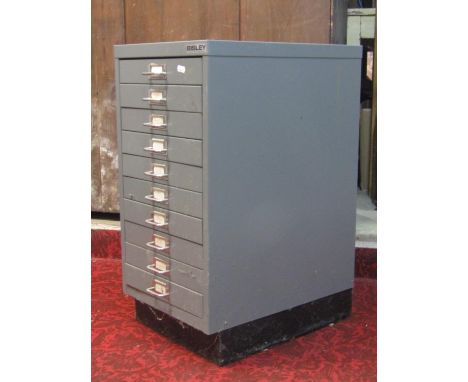 A vintage green painted steel filing cabinet presented as two towers of seven index drawers, together with a more contemporar