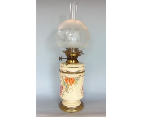 A late 19th century ceramic waisted oil lamp, with oak leaf etched shade, 58cm high total 
