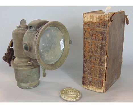 Antique leather bound bible, together with a further vintage carriage lamp and gilt metal military badge (3) 