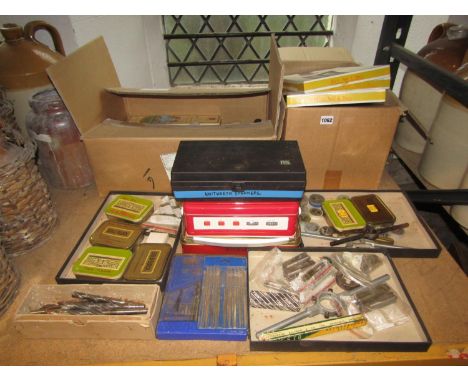 Three boxes of miscellaneous tools to include selection of spanners, drill bits, pick axe, etc 