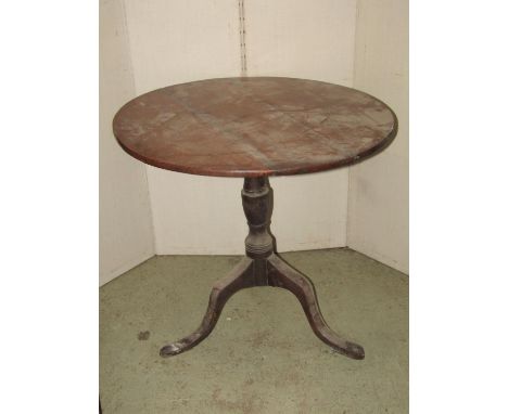 A 19th century oak snap top occasional table of circular form raised on a vase shaped pillar and swept tripod, together with 