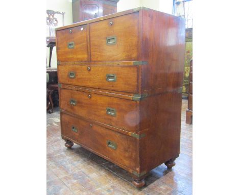 A good unusual two sectional military/campaign chest with brass flush fittings, fitted with an arrangement of five drawers, o